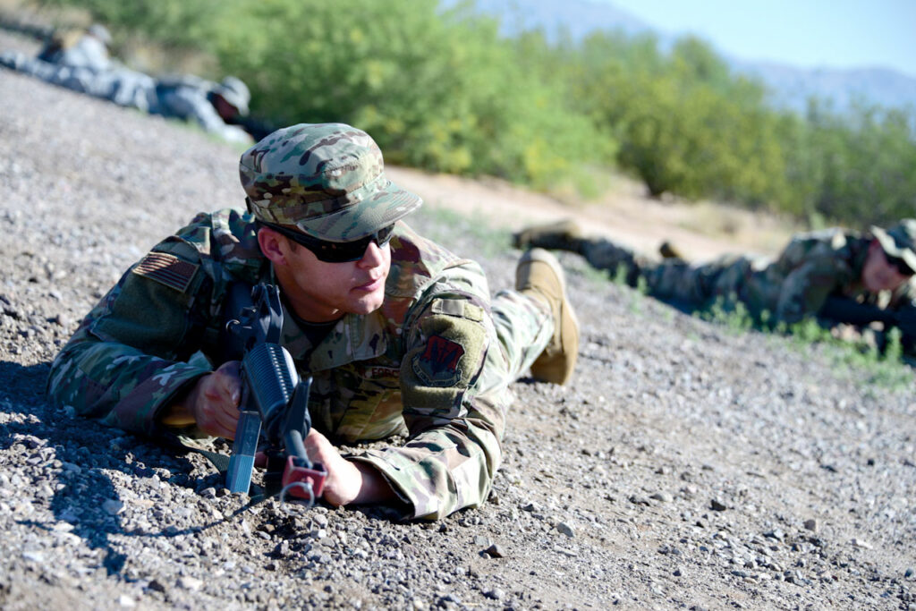 Airman 1st Class Jacob Stephens An Airman assigned to the 355th Maintenance Group communicates with teammates during the first field expeditionary combat skills training at Davis-Monthan Air Force Base. The training was held at the 355th Security Forces Squadron training grounds on D-M AFB.