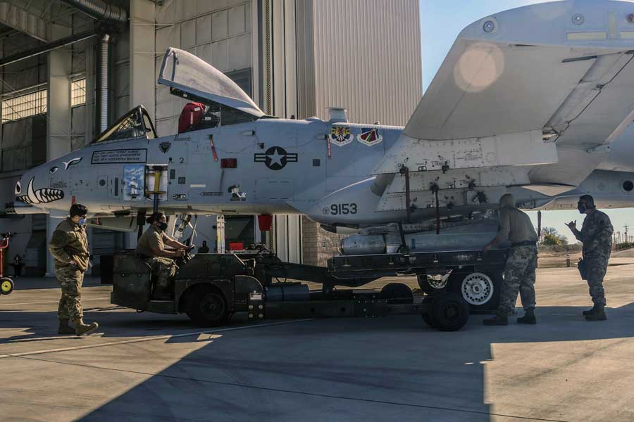 Airmen from the 924th Aircraft Maintenance Unit prepare to load munitions on to an A-10 Thunderbolt II at Davis-Monthan Air Force Base