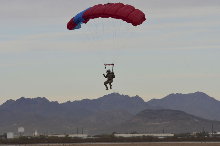 A U.S. Air Force pararescue Airman prepares to land at a drop zone on Davis-Monthan Air Force Base