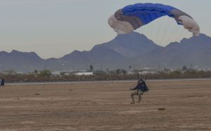 A U.S. Air Force pararescue Airman prepares to land at a drop zone on Davis-Monthan Air Force Base