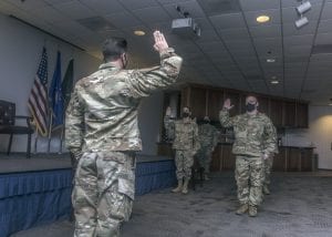 U.S. Space Force 1st Lt. Anthony Fernandes gives the oath of enlistment to five Guardians during a U.S. Space Force Induction Ceremony at Davis-Monthan Air Force Base