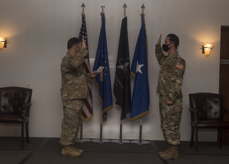 Brig. Gen. Craig Baker, 12th Air Force vice commander, gives the oath of office to U.S. Space Force 1st Lt. Anthony Fernandes during a U.S. Space Force Induction Ceremony at Davis-Monthan Air Force Base