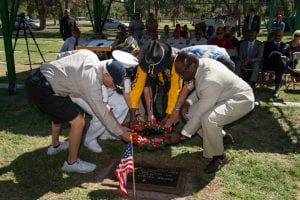 A wreath is laid at the restored headstone of Medal of Honor recipient Marine Corps Pfc. Oscar P. Austin