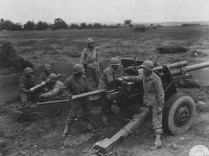 An African American M5 gun crew prepares for action