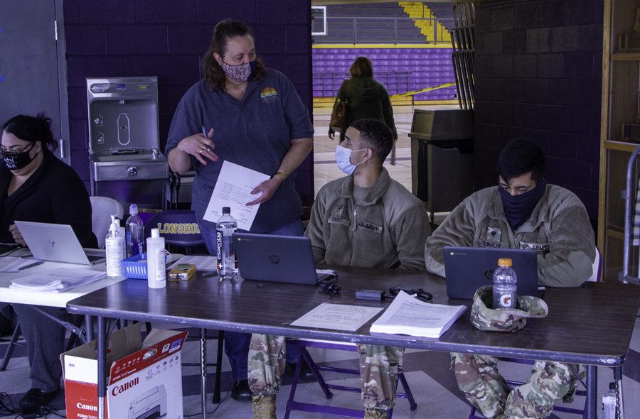 Arizona Army National Guard Soldiers administer the COVID-19 vaccine to Gila County residents Feb. 1, 2021 at Payson Highschool. Guard members continue to support the state by stocking food banks, as well as distributing and administering the vaccine.