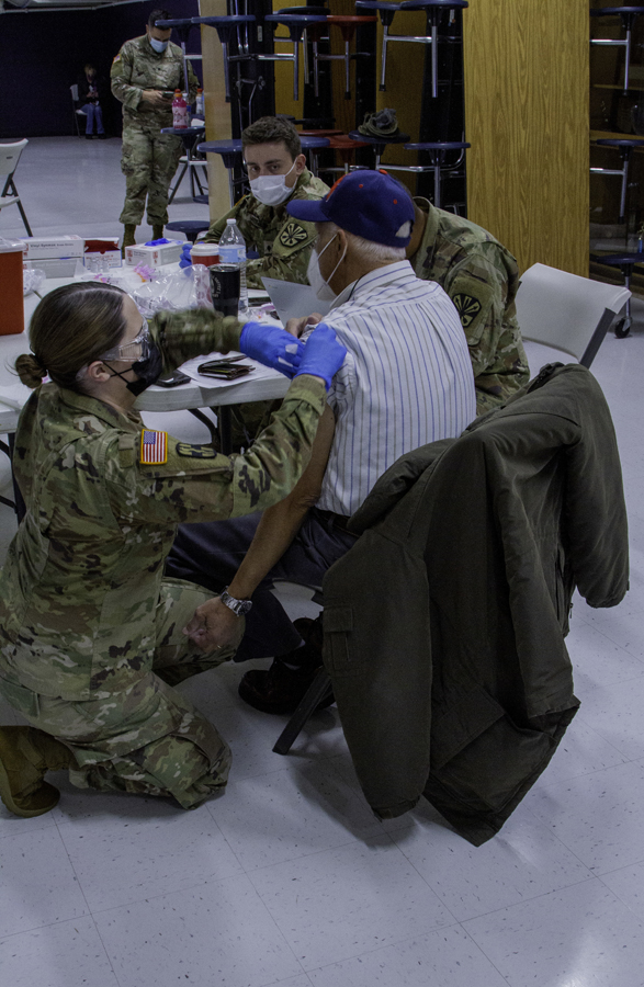 Arizona Army National Guard Soldiers administer the COVID-19 vaccine to Gila County residents Feb. 1, 2021 at Payson Highschool. Guard members continue to support the state by stocking food banks, as well as distributing and administering the vaccine.