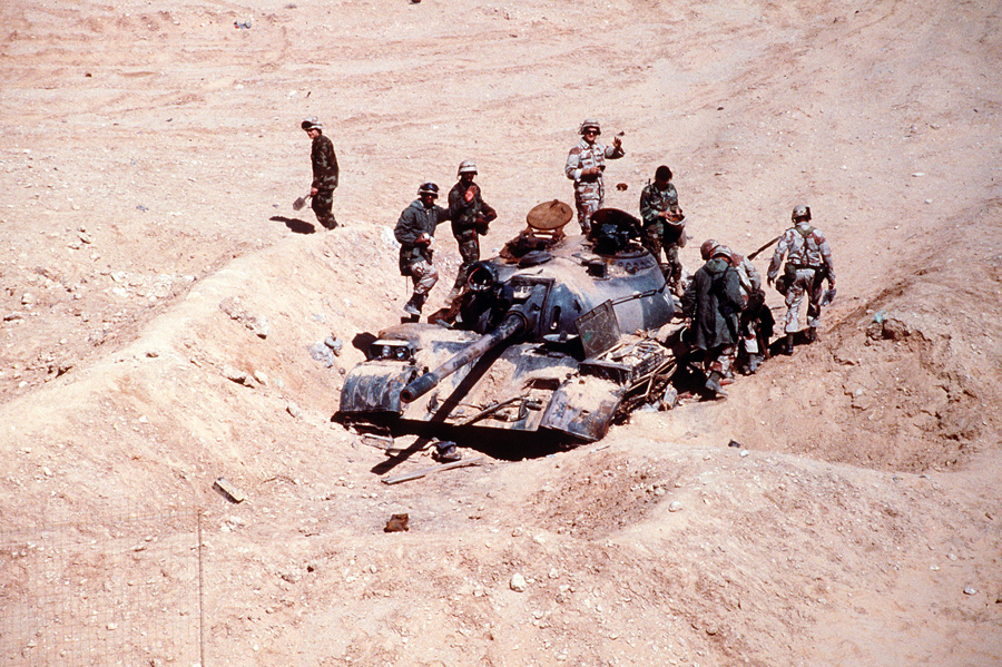 Soldiers examine an Iraqi T-55 main battle tank