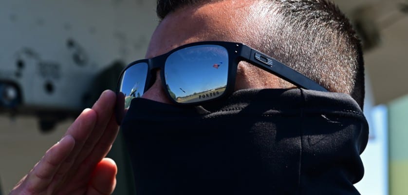 U.S. Air Force Tech. Sgt. Brian Pontes, A-10 Thunderbolt II Demonstration Team NCO in-charge and narrator, salutes the flag during the playing of the National Anthem