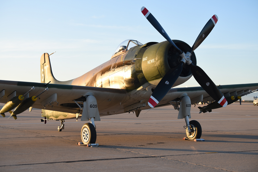 An A-1 Skyraider sits on the flight line