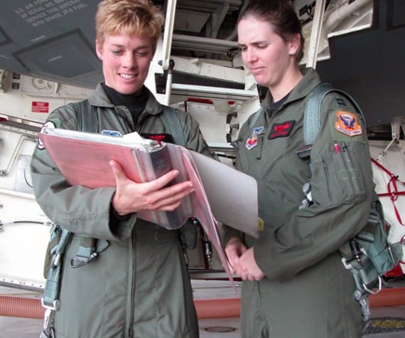 Maj. Kristin Goodwin and Capt. Jenn Jeffords review checklists