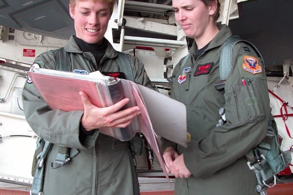 Maj. Kristin Goodwin and Capt. Jenn Jeffords review checklists