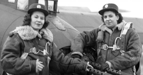 WACs pose by the tail guns of a 401st BG B-17