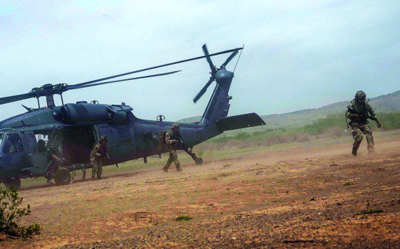 Members of the United Kingdom's Royal Air Force Regiment exit an HH-60G Pave Hawk assigned to the 55th Rescue Squadron, at Playas Training Center, New Mexico, Aug. 11, 2022. Red Flag-Rescue is the Department of Defense's premier combat search and rescue exercise, involving various wings and partner nations. (U.S. Air Force Photo by Airman 1st Class William Turnbull)