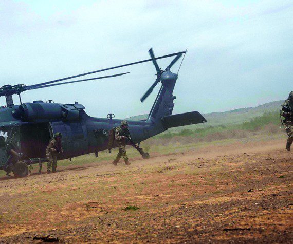 Members of the United Kingdom's Royal Air Force Regiment exit an HH-60G Pave Hawk assigned to the 55th Rescue Squadron, at Playas Training Center, New Mexico, Aug. 11, 2022. Red Flag-Rescue is the Department of Defense's premier combat search and rescue exercise, involving various wings and partner nations. (U.S. Air Force Photo by Airman 1st Class William Turnbull)
