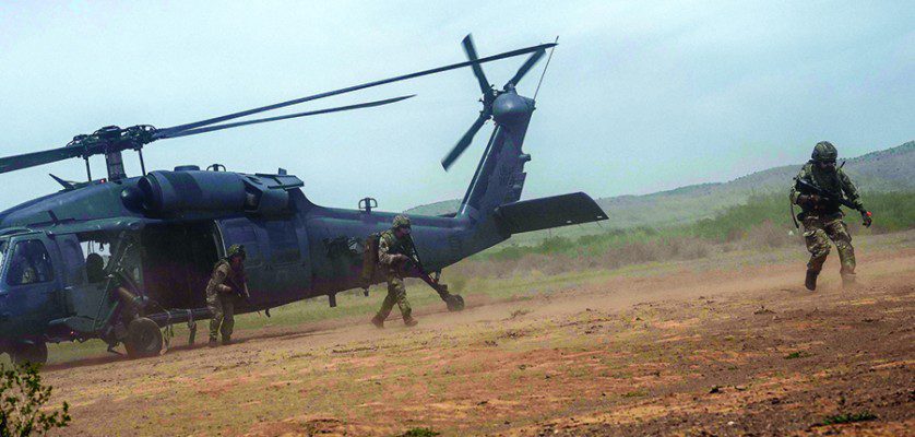 Members of the United Kingdom's Royal Air Force Regiment exit an HH-60G Pave Hawk assigned to the 55th Rescue Squadron, at Playas Training Center, New Mexico, Aug. 11, 2022. Red Flag-Rescue is the Department of Defense's premier combat search and rescue exercise, involving various wings and partner nations. (U.S. Air Force Photo by Airman 1st Class William Turnbull)