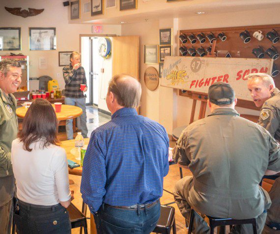 Reserve Citizen Airmen of the 47th Fighter Squadron gather around their restored and freshly unveiled World War II era flag at the 47th FS clubhouse at Davis-Monthan Air Force Base, Ariz., March 3, 2023. To commemorate the complete restoration of the flag, the 47th FS hosted a family day, flag unveiling, and barbecue competition, centered on gathering around the same 47th FS flag their WWII alums once did in Iwo Jima.
