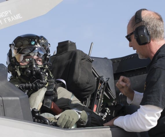 Then Marine Corps Maj. Aaron Frey, 461st Flight Test Squadron, speaks with Jim Kristo, 461st FLTS, while seated in an F-35B during tests of a chemical/biological pilot ensemble at Edwards Air Force Base, Calif. Fray passed away July 5, 2021, in a traffic accident accident near Panamint Valley, Calif. Air Force photograph by Brad White