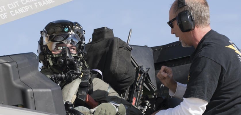 Then Marine Corps Maj. Aaron Frey, 461st Flight Test Squadron, speaks with Jim Kristo, 461st FLTS, while seated in an F-35B during tests of a chemical/biological pilot ensemble at Edwards Air Force Base, Calif. Fray passed away July 5, 2021, in a traffic accident accident near Panamint Valley, Calif. Air Force photograph by Brad White