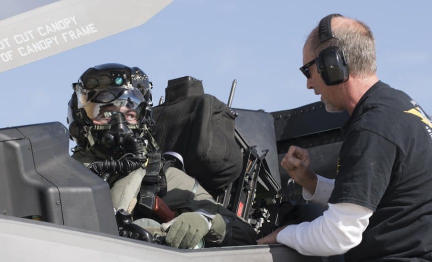 Then Marine Corps Maj. Aaron Frey, 461st Flight Test Squadron, speaks with Jim Kristo, 461st FLTS, while seated in an F-35B during tests of a chemical/biological pilot ensemble at Edwards Air Force Base, Calif. Fray passed away July 5, 2021, in a traffic accident accident near Panamint Valley, Calif. Air Force photograph by Brad White