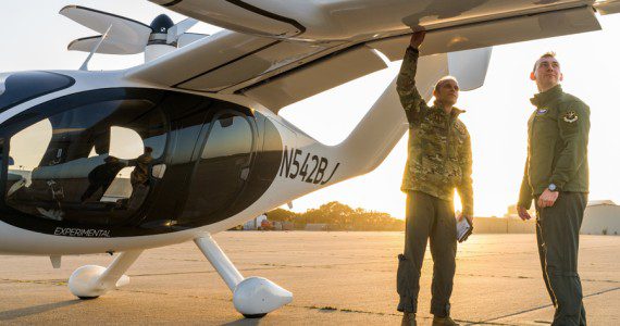 Maj. Mike Corson (left), 418th Flight Test Squadron pilot, and Capt. Terrence McKenna, AFWERX Agility Prime test and experimentation lead, perform a pre-flight check on a Joby S4 aircraft. The Joby S4 is a five-seat electric vertical takeoff and landing (eVTOL) aircraft.