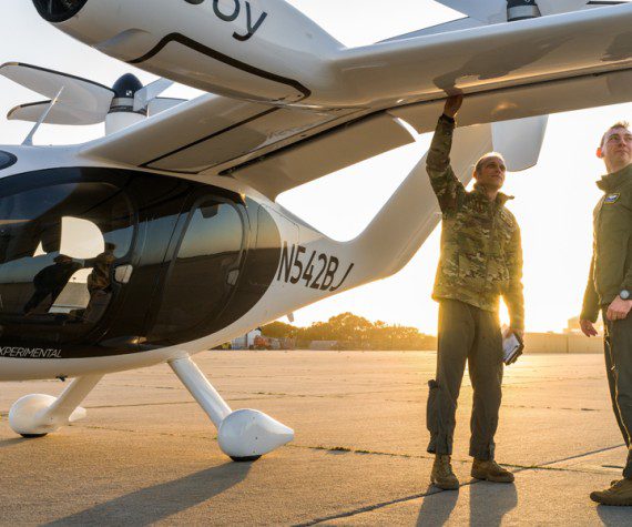 Maj. Mike Corson (left), 418th Flight Test Squadron pilot, and Capt. Terrence McKenna, AFWERX Agility Prime test and experimentation lead, perform a pre-flight check on a Joby S4 aircraft. The Joby S4 is a five-seat electric vertical takeoff and landing (eVTOL) aircraft.