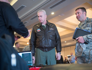 Air Force photograph by Senior Airman Ridge Shan  Col. Michael Richardson, 56th Fighter Wing vice commander, and Maj. Nathaniel Edwards, 56th Communications Squadron commander, listen to a technology company representative as he briefs them on new technology solutions during the 2018 Luke Tech Expo at Luke Air Force Base, Ariz., Feb. 22, 2018. The tech expo demonstrated numerous technologies and advancements in communications and other fields related to the mission of the 56th Fighter Wing