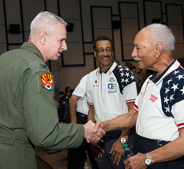 Air Force photograph by Airman 1st Class Alexander Cook Col. Michael Richardson, 56th Fighter Wing vice commander, shakes hands with retired Lt. Col. Robert Ashby, Tuskegee Airman, during the 2018 Tuskegee Airmen Honor Event at Luke Air Force Base, Ariz., Feb. 15, 2018. Following the event, Airmen participated in a meet-and-greet with Ashby to thank him for the contributions made to the Air Force throughout his career.
