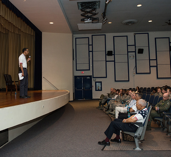 Air Force photograph by Airman 1st Class Alexander Cook Ben Bruce, 56th Fighter Wing occupational safety manager, speaks to Thunderbolts during the 2018 Tuskegee Airmen Honor Event at Luke Air Force Base, Ariz., Feb. 15, 2018. The event was held to commemorate Black History Month and recognize the continued achievements and contributions made by the Tuskegee Airmen to the Air Force culture