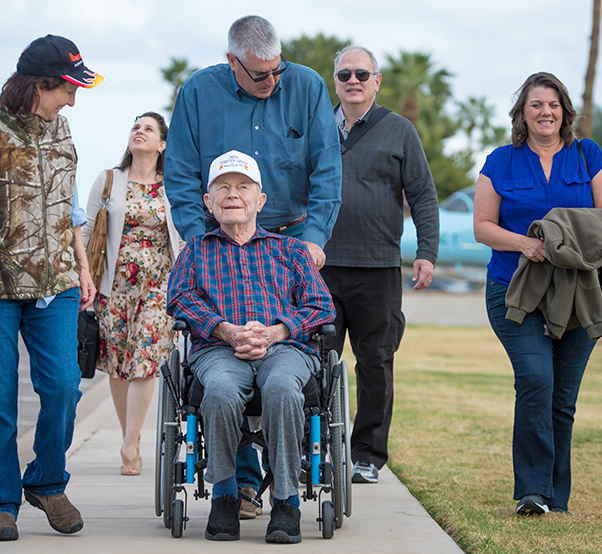 Air Force photograph by Staff Sgt. Jensen Stidham Retired Brig. Gen. Chuck Yeager is assisted around the air park during a tour at Luke Air Force Base, Ariz., Feb. 13, 2018. Yeager visited the base he received his pilot wings in 1943, as part of his 95th birthday celebration.