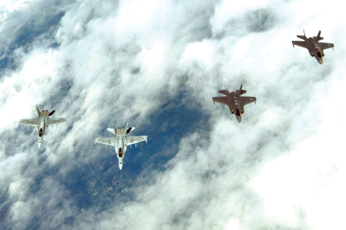 F-35s fly with Finnish F-18s