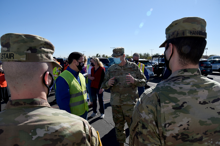 Maj. Gen. Michael T. McGuire, Adjutant General for the Arizona National Guard, speaks to Arizona Governor Doug Ducey, about the Arizona National Guard’s mission at a state run, Federal Emergency Management Agency supported, COVID-19 vaccination distribution facility in Glendale, Ariz., Feb. 05, 2021. The governor and other VIPs visited the pharmacy, where the vaccinations are stored and syringes are filled, as well as all stages of the drive-through vaccination distribution site. (U .S. Air National Guard photo by Tech. Sgt.