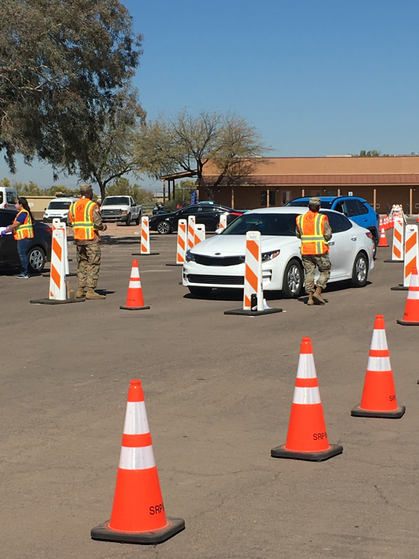 Arizona National Guard medics and logistics personnel administer the COVID-19 vaccine