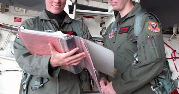 Maj. Kristin Goodwin and Capt. Jenn Jeffords review checklists