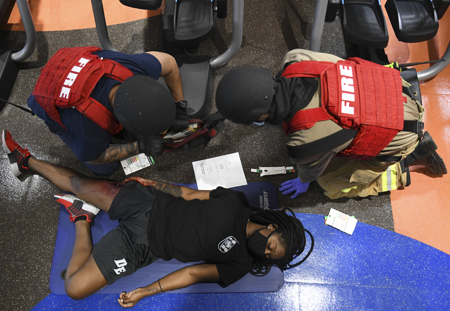 Jose Moreno, left, and Staff Sgt. Domitrius Johnson, right, 56th Civil Engineer Squadron firefighters