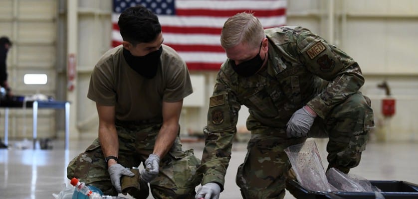 Staff Sgt. Sergio Tosi, 944th Aeromedical Staging Squadron medical technician and Senior Master Sgt. Jeffrey Neilsen, 944th ASTS medical material medic, prepare pork tracheas