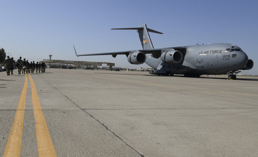 Airmen from the 56th Fighter Wing walk to a C-17 Globemaster III Sept. 13, 2021, at Luke Air Force Base, Ariz.. The C-17 from Altus Air Force Base, Okla., will be transporting Luke Airmen to Joint Base McGuire-Dix-Lakehurst, N.J., in support of Operation Allies Welcome, where they will assist with medical screenings, lodging, and other general support services for Afghan evacuees. Luke Airmen rapidly mobilized to answer the call for support with less than a four-day notice to assist with the sheltering of thousands of Afghan evacuees from Kabul, Afghanistan. (Air Force photograph by Tech. Sgt. Amber Carter)
