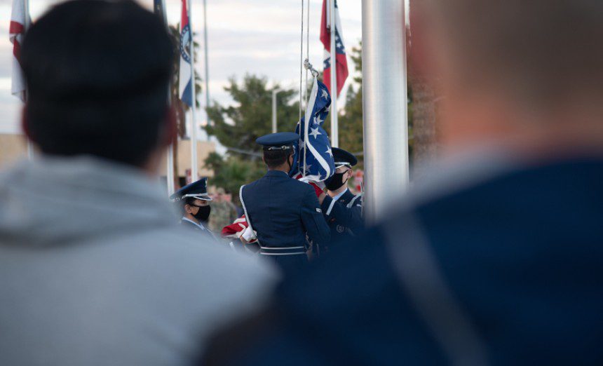 Luke Air Force Base Honor Guard performs a flag folding ceremony during the Patriot All-America golf tournament base tour Dec. 29, 2021, at Luke AFB, Ariz. During the Patriot All-American golf tournament, each golfer carries a golf-club bag displaying the name of a fallen or severely wounded service member. Participants received a base tour that included a 56th Security Forces Squadron working dog demonstration and an F-16 Fighting Falcon and F-35 Lightning II aircraft display to showcase the 56th Fighter Wing mission. (Air Force photograph by Staff Sgt. Collette Brooks)