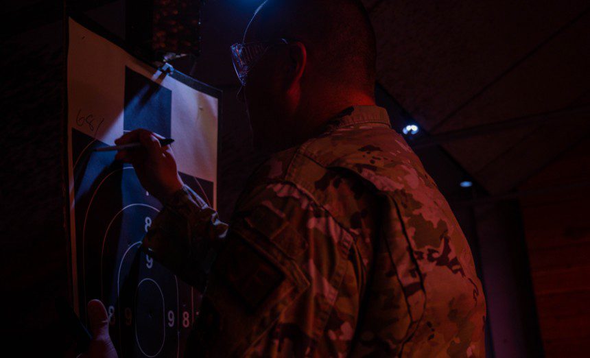U.S. Air Force Staff Sgt. Nathan Rust, 56th Security Forces Squadron combat arms instructor, writes a score on a target, May 17, 2023, at Luke Air Force Base, Arizona. The 56th SFS held a shooting competition as one of the squadron’s events for National Police Week. Luke AFB’s combat arms instructors are responsible for ensuring every 56th SFS member is proficient and skilled in their ability to use weapons when an emergency arises. (U.S. Air Force photo by Airman 1st Class Elias Carrero)