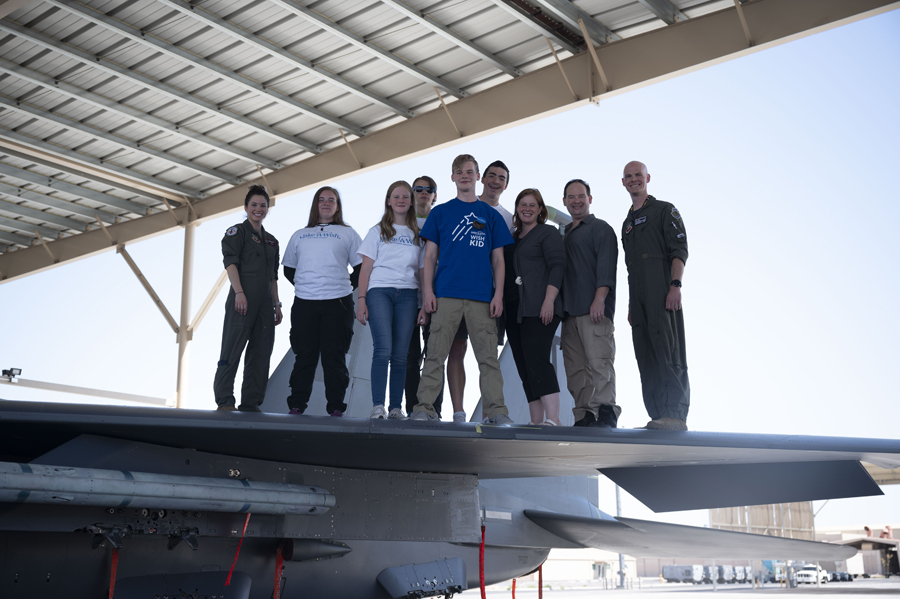 Joseph D. and his family pose for a group picture after receiving a tour of the F-15E Strike Eagle with the help of Nellis Airmen and the Make-A-Wish foundation at Nellis Air Force Base, Nev., June 2, 2023. For more information on the Make-A-Wish Foundation, visit http://wish.org (Air Force photograph by Senior Airman Zachary Rufus)