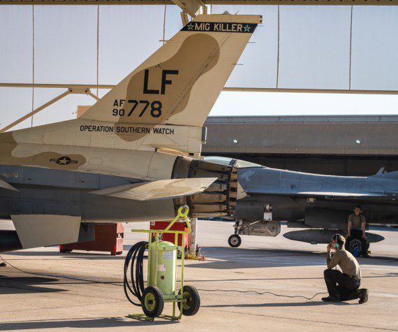 Airman 1st Class Keilani Durfey, 309th Aircraft Maintenance Unit crew chief, conducts a routine pre-flight check on an F-16 Fighting Falcon before takeoff, July 10, 2023, at Luke Air Force Base, Ariz. This aircraft painted in a desert brown color scheme known as the ëMiG Killer’, is part of an F-16 block swap between the 309th FS and the 49th Wing at Holloman Air Force Base, N.M. (Air Force photograph by Senior Airman Dominic Tyler)