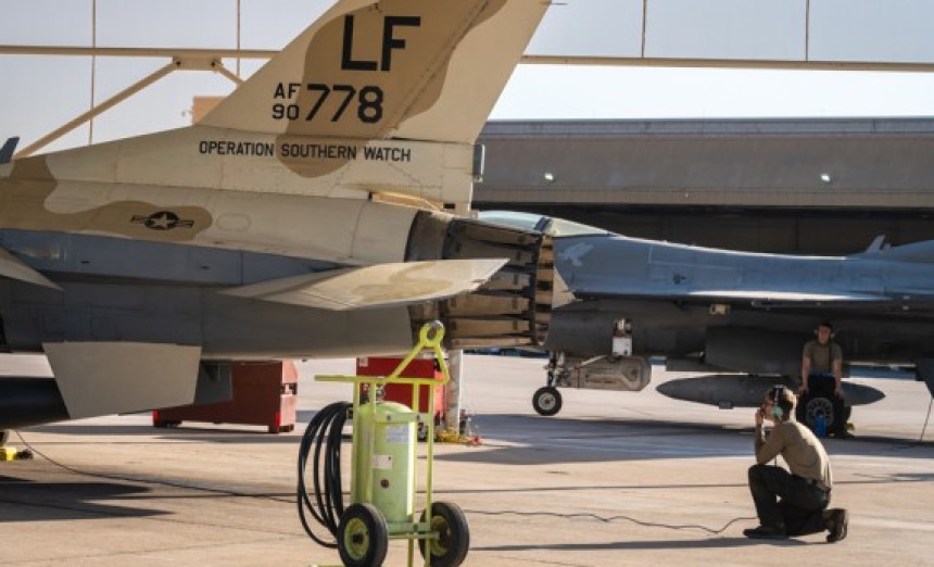 Airman 1st Class Keilani Durfey, 309th Aircraft Maintenance Unit crew chief, conducts a routine pre-flight check on an F-16 Fighting Falcon before takeoff, July 10, 2023, at Luke Air Force Base, Ariz. This aircraft painted in a desert brown color scheme known as the ëMiG Killer’, is part of an F-16 block swap between the 309th FS and the 49th Wing at Holloman Air Force Base, N.M. (Air Force photograph by Senior Airman Dominic Tyler)