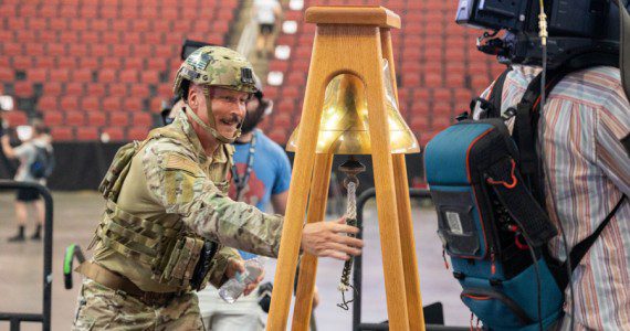 Chief Master Sgt. Brian Smith, 56th Operations Group senior enlisted leader, rings a bell after completing the 9/11 Tower Challenge, Sept. 11, 2023, at Desert Diamond Arena, Glendale, Ariz. Participants of the challenge climbed 110 floors around the arena in honor of the first responders who ascended the World Trade Center during the terrorist attacks on Sept. 11, 2001. This year marks 22 years since the attacks, which claimed 2,977 lives, including over 400 first responders.
