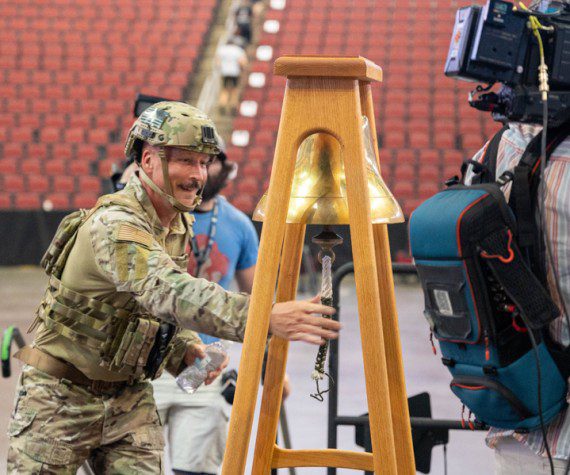 Chief Master Sgt. Brian Smith, 56th Operations Group senior enlisted leader, rings a bell after completing the 9/11 Tower Challenge, Sept. 11, 2023, at Desert Diamond Arena, Glendale, Ariz. Participants of the challenge climbed 110 floors around the arena in honor of the first responders who ascended the World Trade Center during the terrorist attacks on Sept. 11, 2001. This year marks 22 years since the attacks, which claimed 2,977 lives, including over 400 first responders.