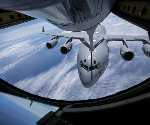 A U.S. Air Force C-17 Globemaster III with the North Carolina Air National Guard's 145th Airlift Wing flies behind a KC-135R Stratotanker with the New Jersey Air National Guard's 108th Wing during a refueling mission over the Atlantic Ocean on May 25, 2021. The KC-135 Stratotanker provides the core aerial refueling capability for the United States Air Force and has excelled in this role for more than 60 years. This unique asset enhances the Air Force's capability to accomplish its primary mission of global reach. It also provides aerial refueling support to Air Force, Navy, Marine Corps and allied nation aircraft. The KC-135 is also capable of transporting litter and ambulatory patients using patient support pallets during aeromedical evacuations. (U.S. Air National Guard photo by Master Sgt. Matt Hecht)