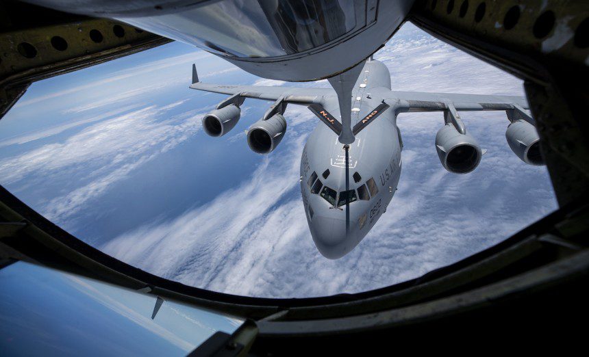 A U.S. Air Force C-17 Globemaster III with the North Carolina Air National Guard's 145th Airlift Wing flies behind a KC-135R Stratotanker with the New Jersey Air National Guard's 108th Wing during a refueling mission over the Atlantic Ocean on May 25, 2021. The KC-135 Stratotanker provides the core aerial refueling capability for the United States Air Force and has excelled in this role for more than 60 years. This unique asset enhances the Air Force's capability to accomplish its primary mission of global reach. It also provides aerial refueling support to Air Force, Navy, Marine Corps and allied nation aircraft. The KC-135 is also capable of transporting litter and ambulatory patients using patient support pallets during aeromedical evacuations. (U.S. Air National Guard photo by Master Sgt. Matt Hecht)