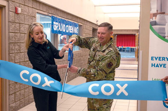 U.S. Air Force Col. Peter Abercrombie (right), 56th Mission Support Group commander, and Susan Anable (left, Cox Phoenix market vice president, cut a ribbon during a grand opening ceremony of the Luke Air Force Base Cox Innovation Lab, Feb. 23, 2024. Luke AFB partnered with Cox and the Boys & Girls Club of the Valley to construct the lab, opening a new opportunity for Luke children to learn about Science, Technology, Engineering, and Math careers. (U.S. Air Force photos by Senior Airman Jakob Hambright)