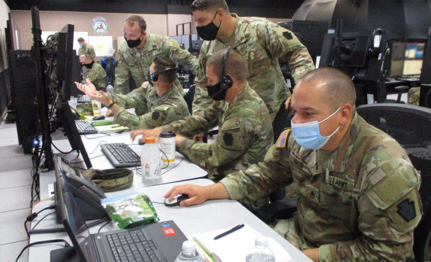 U.S. service members participating in the first Virtual Flag exercise dedicated to training the Joint Air Ground Integration Centerís command and control at the 705th Combat Training Squadronís Distributed Mission Operation Center, Kirtland Air Force Base, N.M., Aug. 23-27, 2021. The DMOC is the U.S. Air Forceís hub for distributed combat training exercises and testing. Warfighters at locations around the globe, connected through the DMOC, face realistic threat scenarios to practice tactics and procedures. The DMOC architecture integrates virtual and constructive simulations across various networks to support a synthetic battlespace that models weapons, C2, and intelligence, surveillance and reconnaissance systems. (Air Force photograph)