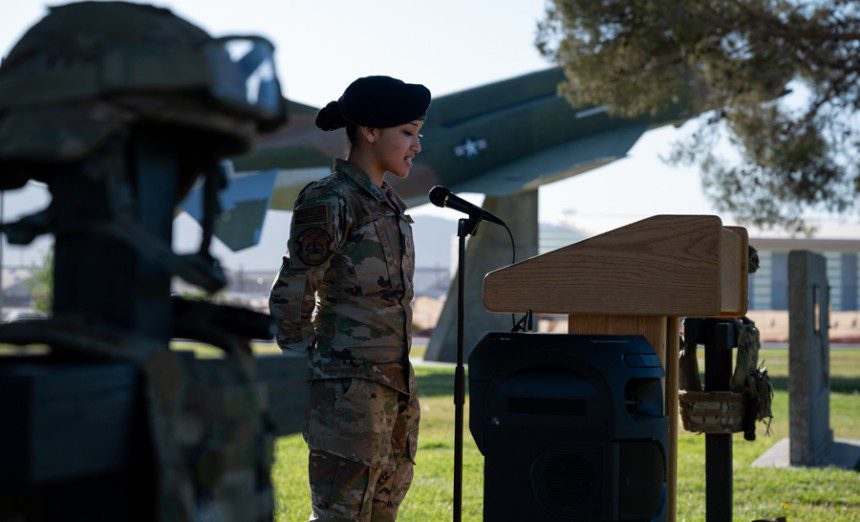 Senior Airman Dianna Barcenas, 99th Security Forces Squadron, speaks during an opening ceremony for National Police Week at Nellis Air Force Base, Nevada, May 16, 2022. National Police Week honors those who serve their communities through law enforcement and pays special tribute to officers who lost their lives in the line of duty while protecting others. (U.S. Air Force photo by Airman 1st Class Josey Blades)