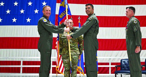 Maj. Gen. Case A. Cunningham, U.S. Air Force Warfare Center commander, passes the guidon to incoming 57th Wing commander, Brig. Gen. Richard A. Goodman, during a change of command ceremony at Nellis Air Force Base, Nev., June 30, 2022. The 57th Wing commander is responsible for 36 squadrons at 12 installations constituting the Air Force’s most diverse flying wing.