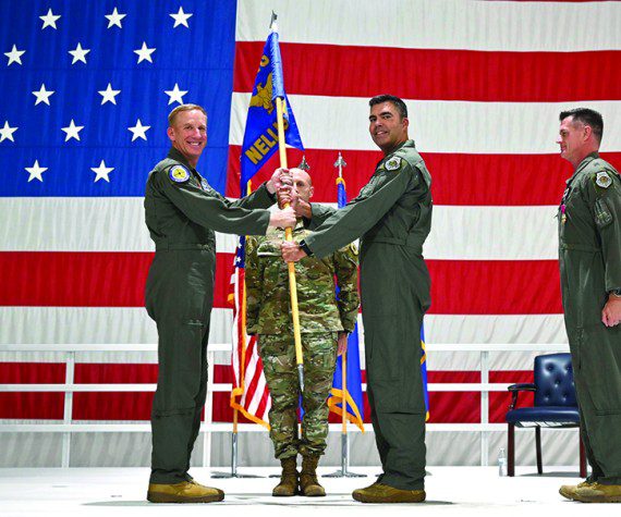 Maj. Gen. Case A. Cunningham, U.S. Air Force Warfare Center commander, passes the guidon to incoming 57th Wing commander, Brig. Gen. Richard A. Goodman, during a change of command ceremony at Nellis Air Force Base, Nev., June 30, 2022. The 57th Wing commander is responsible for 36 squadrons at 12 installations constituting the Air Force’s most diverse flying wing.